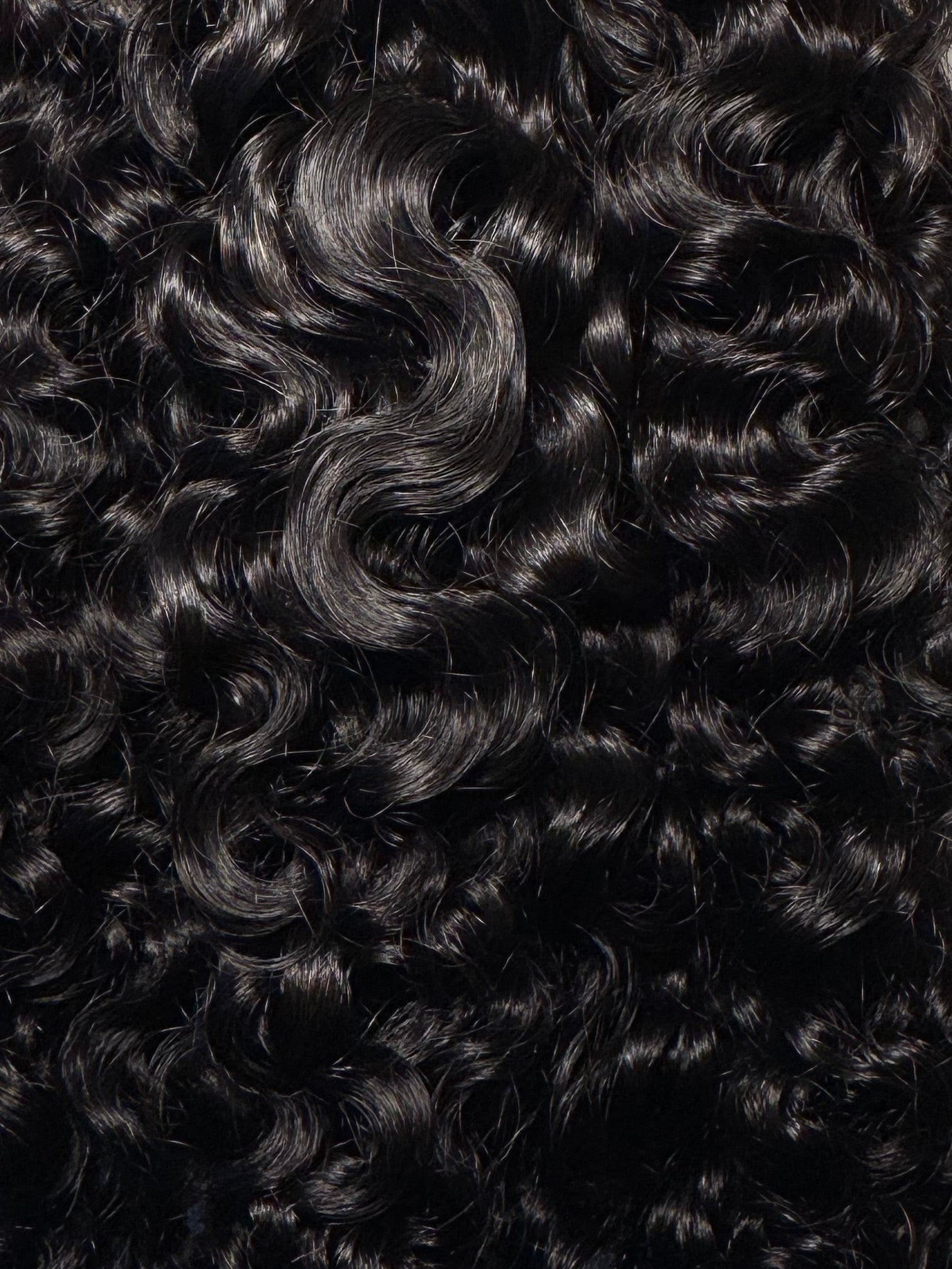 Curly hair extensions on a white background