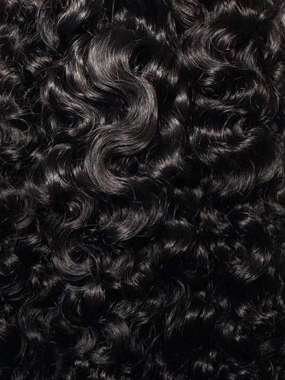 Curly hair extensions on a white background